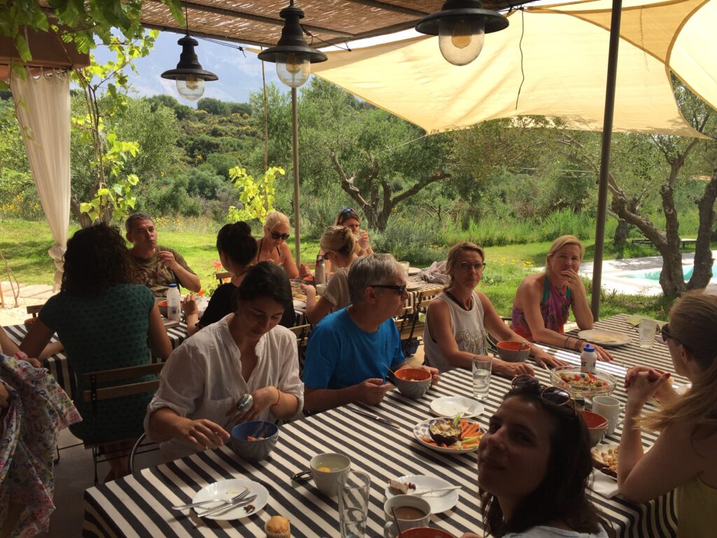 Retreat guests enjoying breakfast together outdoors